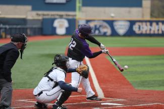 baseball player swinging bat by Chris Chow courtesy of Unsplash.