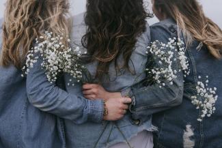 group of women facing backward by Becca Tapert courtesy of Unsplash.
