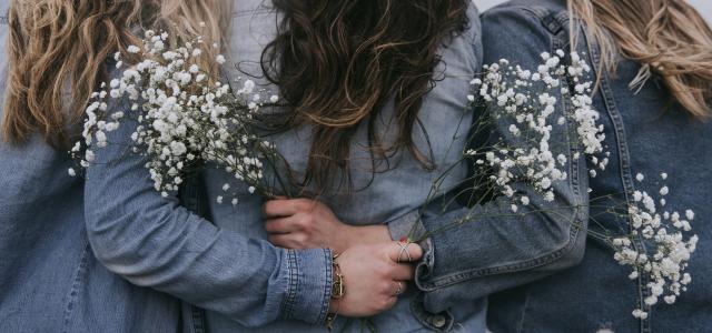 group of women facing backward by Becca Tapert courtesy of Unsplash.